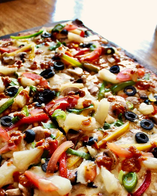A loaded pizza fresh from the oven
