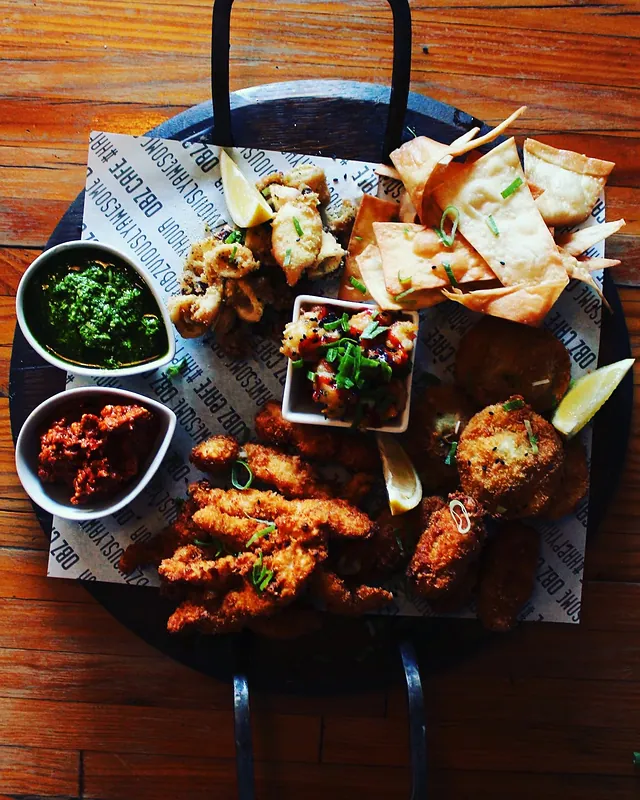 A sharing platter of tapas on a black board