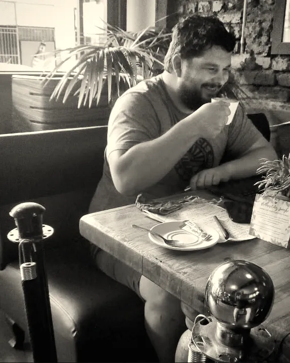 A regular tucking in at a booth