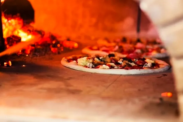 Pizza in the wood-fired oven